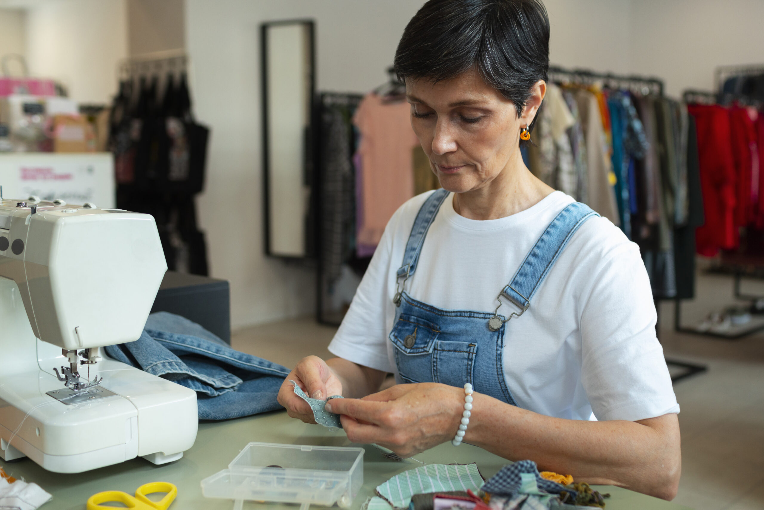 medium-shot-woman-repairing-fashion-goods