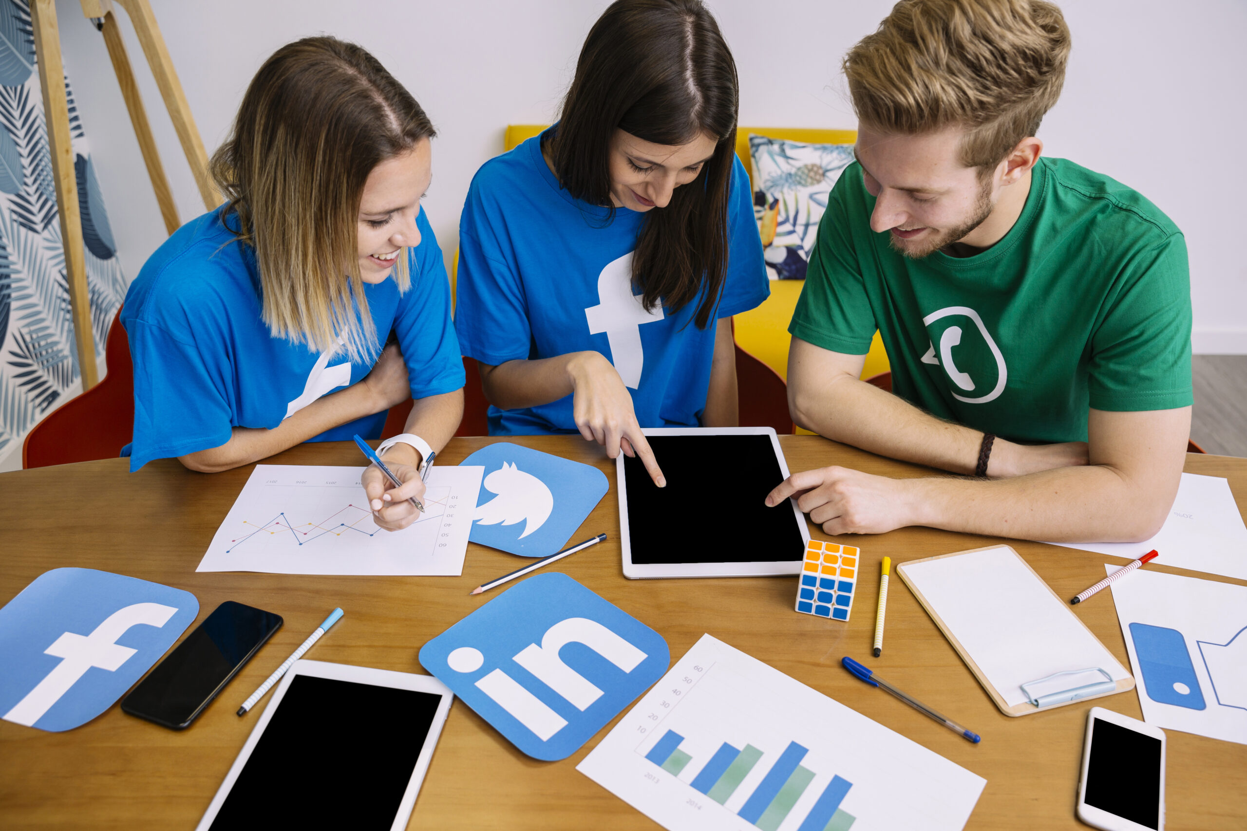 overhead-view-social-media-networking-team-looking-digital-tablet